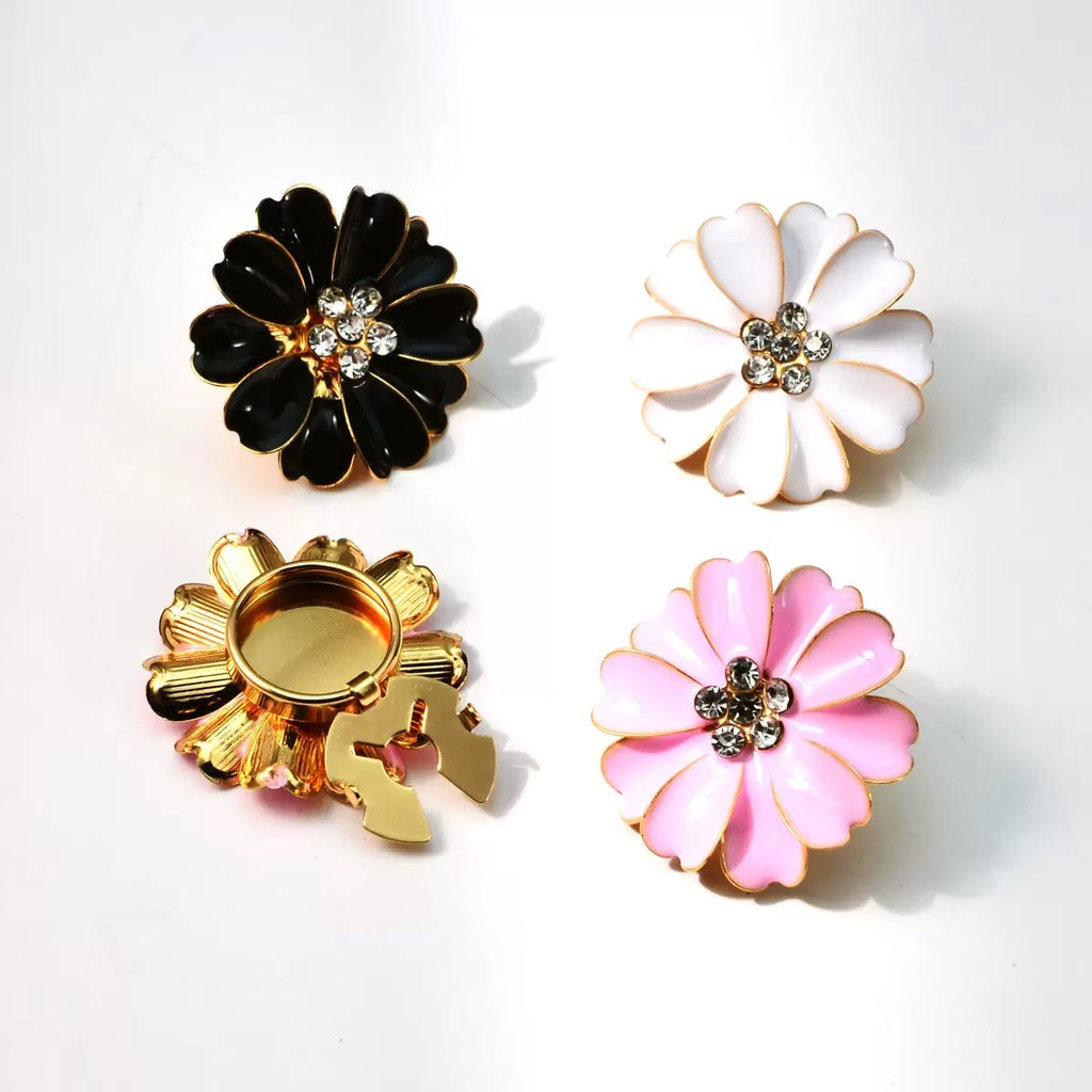 Rhinestone flower brooch pins in black, white, and pink with gold-plated finish
